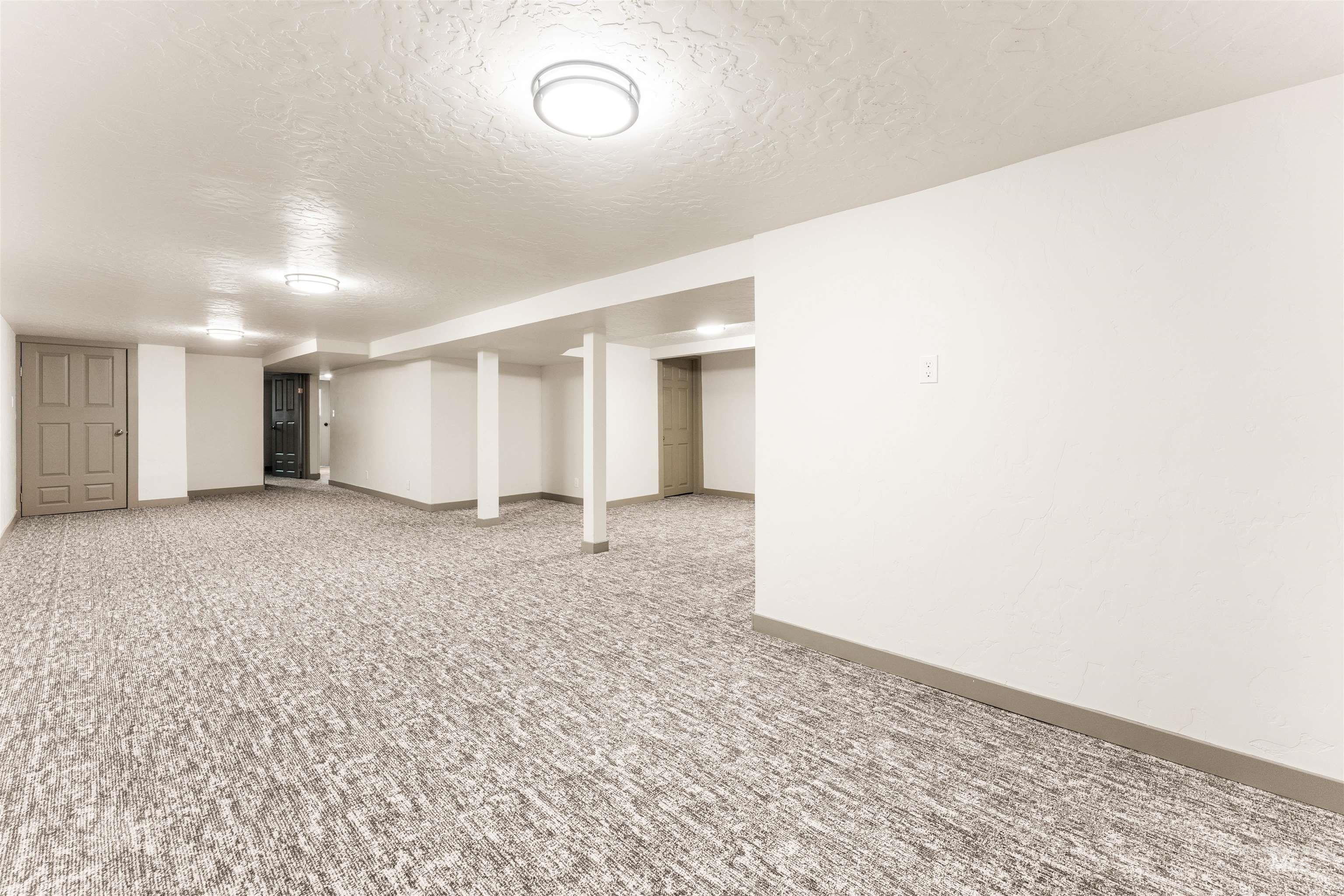 602 North 5th Street Parma, ID 83660 - Photo 44 of 48 Finished below grade area featuring light carpet and a textured ceiling