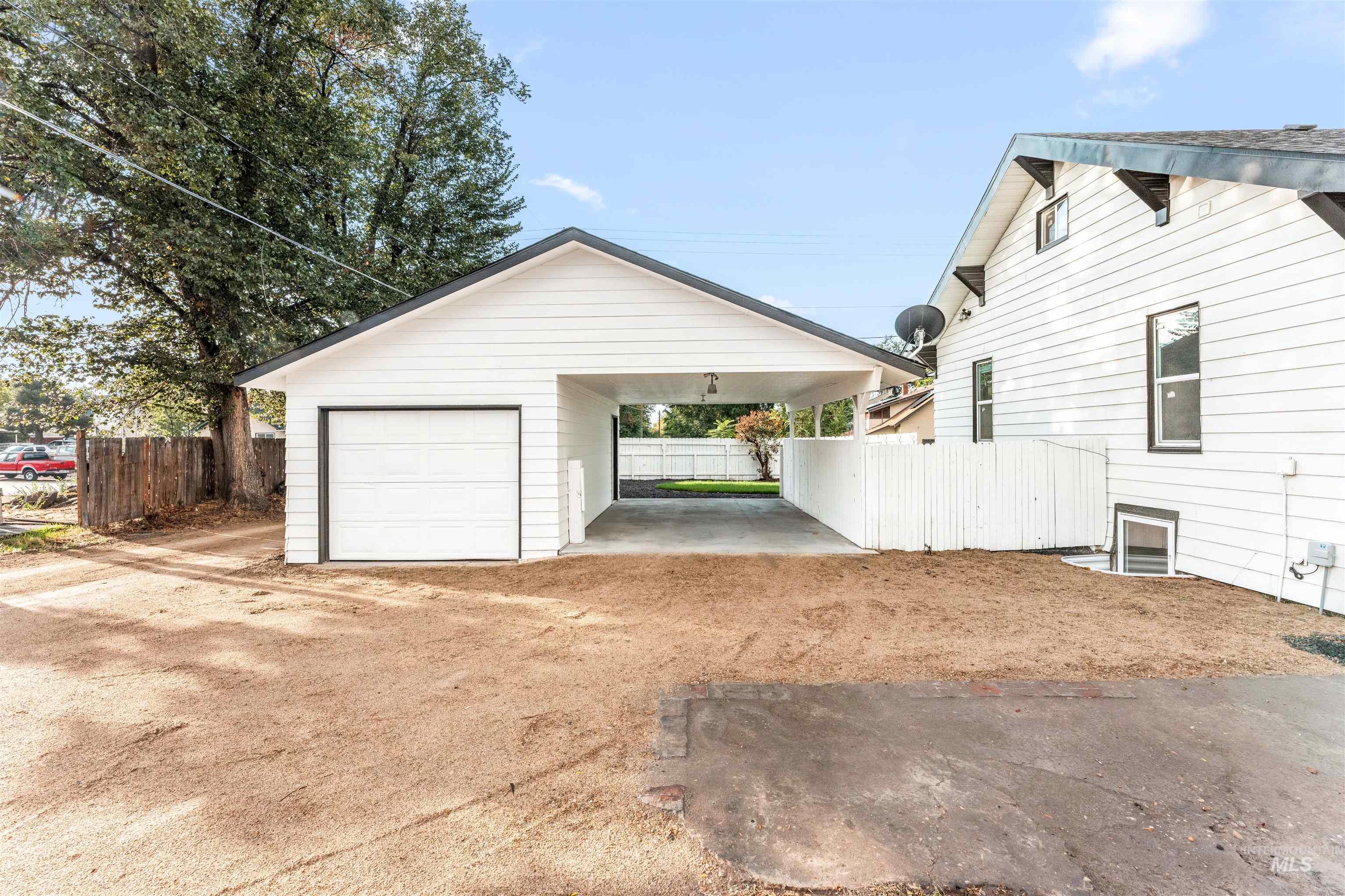 602 North 5th Street Parma, ID 83660 - Photo 9 of 48 Garage with a carport and dirt driveway