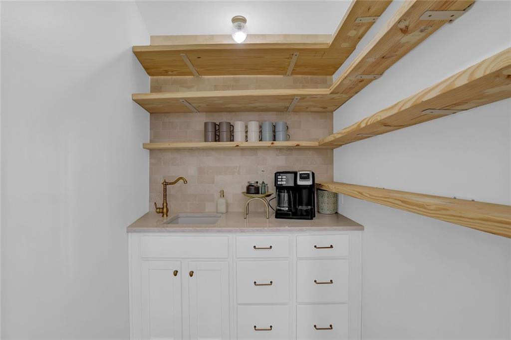 889 Fawn Way Marietta, GA 30068 - Photo 11 of 30 a bathroom with a sink and a mirror