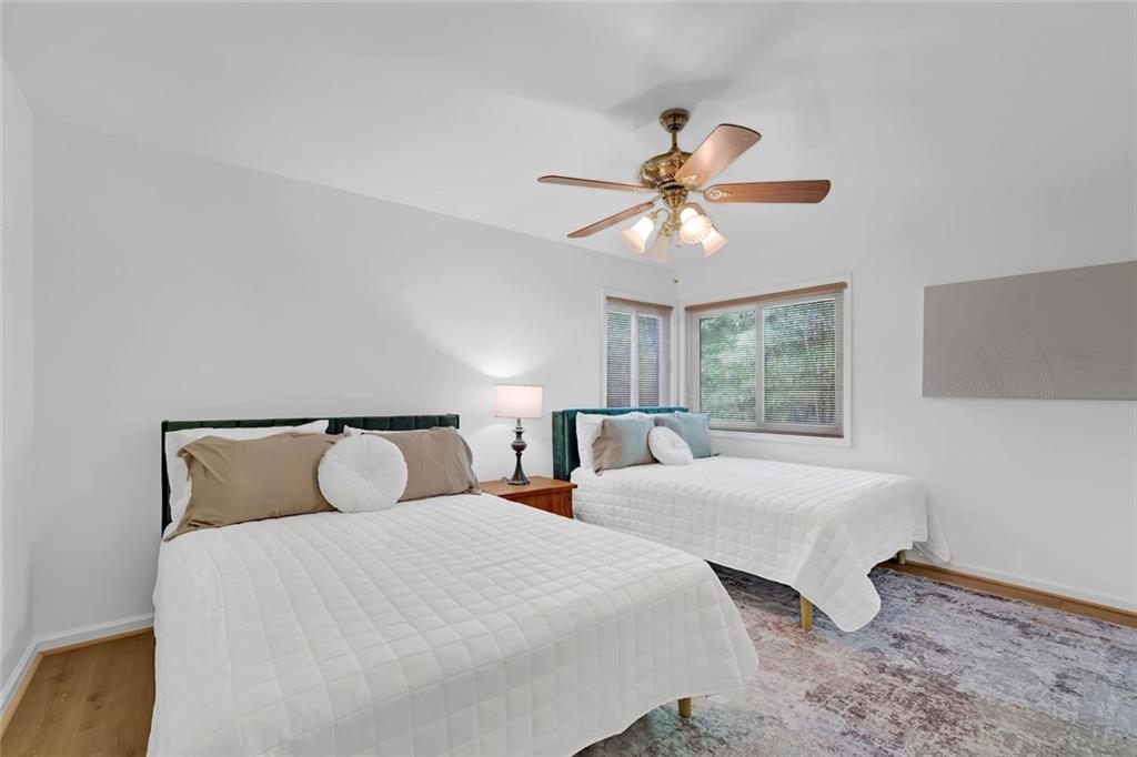 889 Fawn Way Marietta, GA 30068 - Photo 27 of 30 a bedroom with two beds and a chandelier