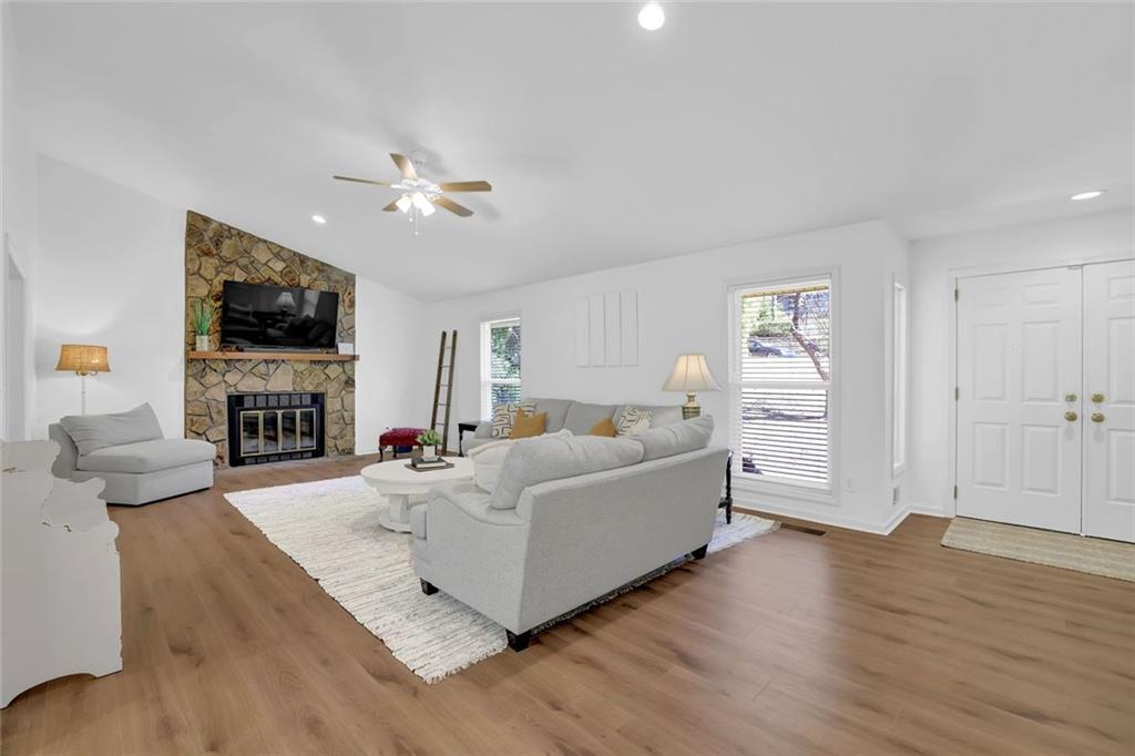 889 Fawn Way Marietta, GA 30068 - Photo 6 of 30 a living room with furniture fireplace and flat screen tv