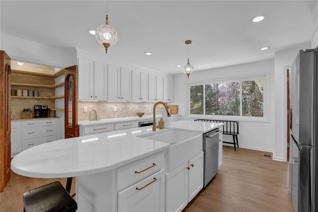 889 Fawn Way Marietta, GA 30068 - Photo 10 of 30 a kitchen with a sink stove and cabinets