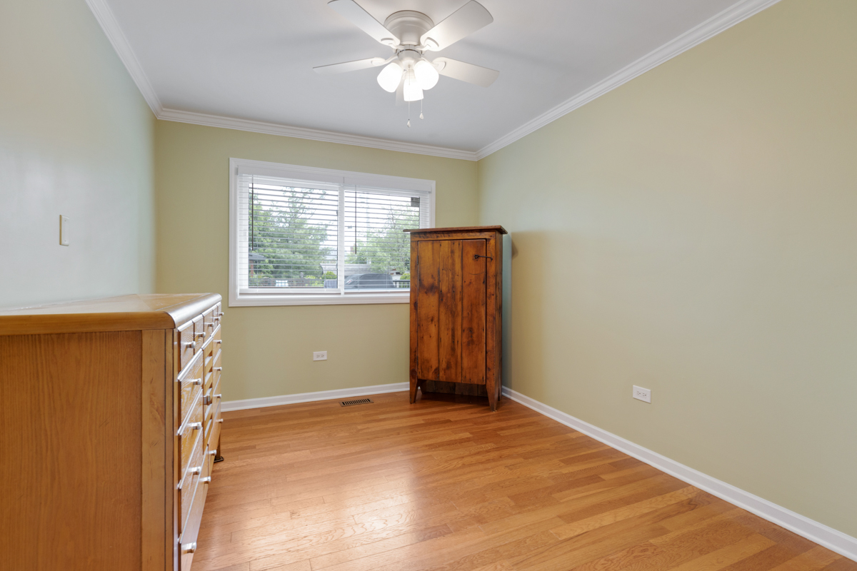 297 Mulberry Road Frankfort, IL 60423 - Photo 26 of 47 an empty room with chandelier fan and windows