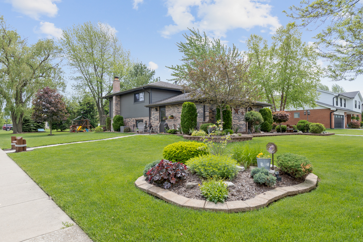 297 Mulberry Road Frankfort, IL 60423 - Photo 28 of 47 a front view of a house with a yard table and seating