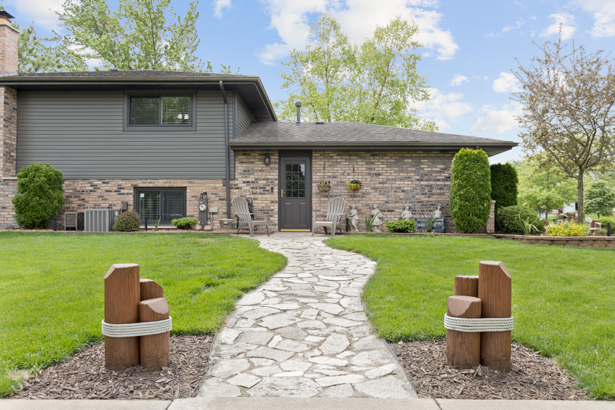 297 Mulberry Road Frankfort, IL 60423 - Photo 29 of 47 a front view of a house with a yard table and chairs