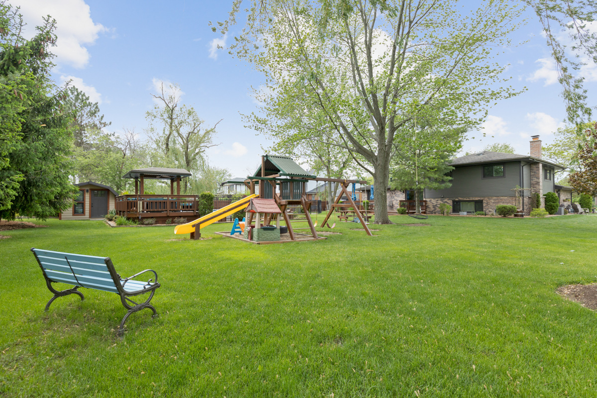 297 Mulberry Road Frankfort, IL 60423 - Photo 32 of 47 a view of a house with a backyard porch and sitting area