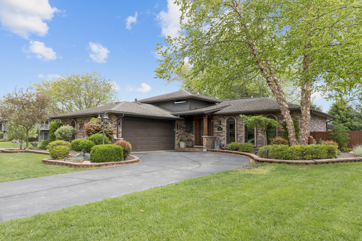 297 Mulberry Road Frankfort, IL 60423 - Photo 5 of 47 a front view of a house with a garden and trees