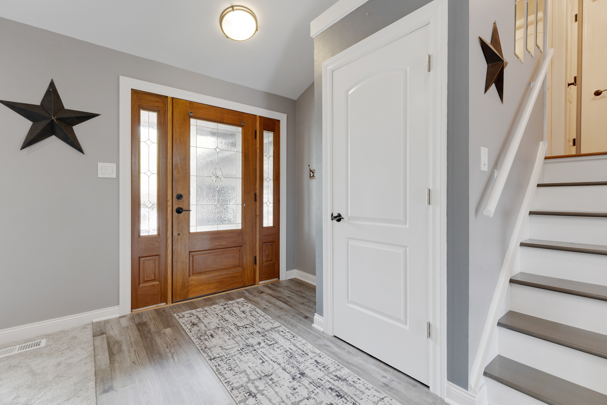 297 Mulberry Road Frankfort, IL 60423 - Photo 6 of 47 a view of a hallway with a hardwood floor and a window