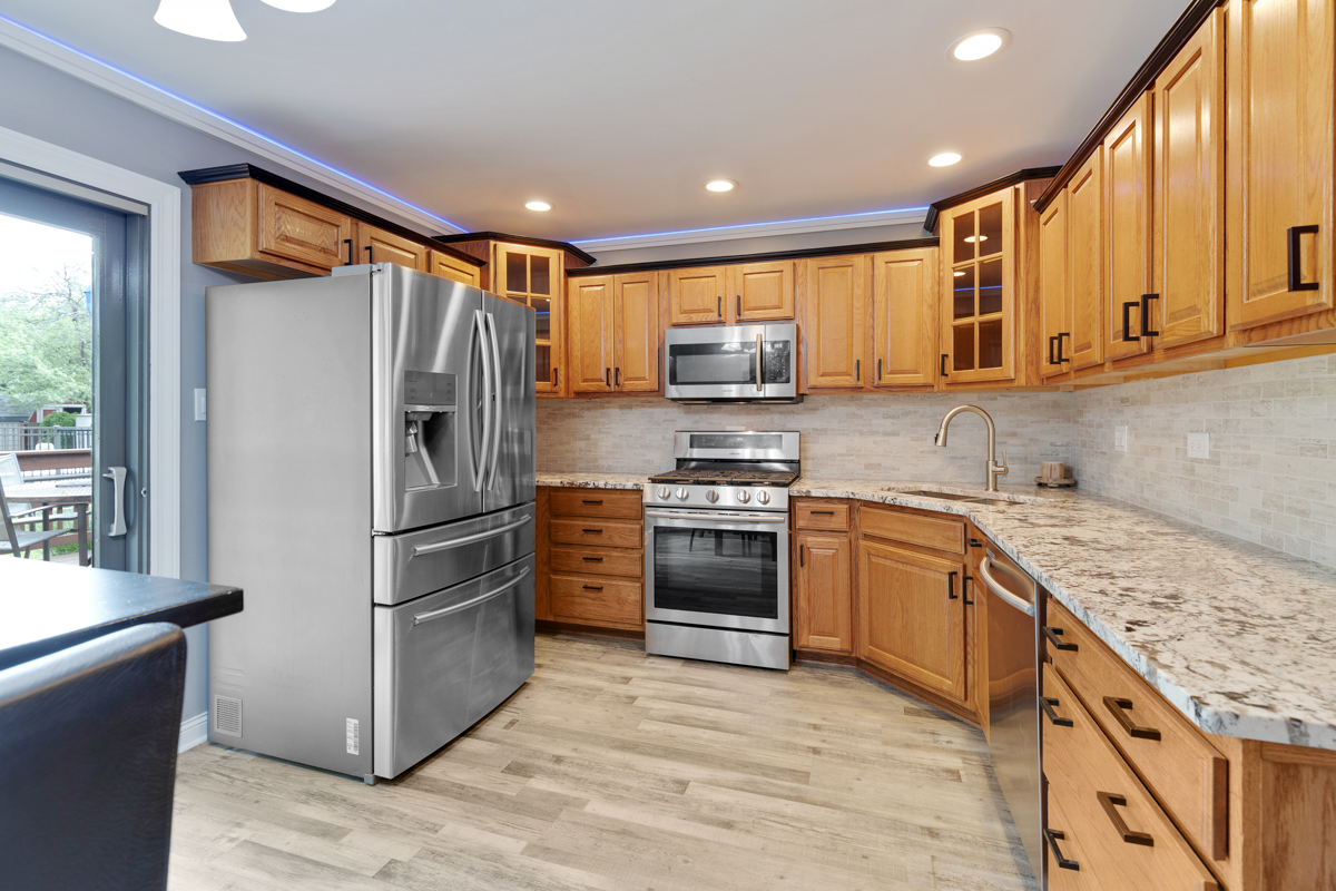 297 Mulberry Road Frankfort, IL 60423 - Photo 10 of 47 a kitchen with stainless steel appliances granite countertop a refrigerator sink and stove