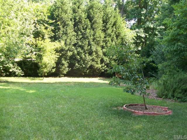 6301 Ashley Ridge Drive Raleigh, NC 27612 - Photo 2 of 12 a view of a golf course with a garden