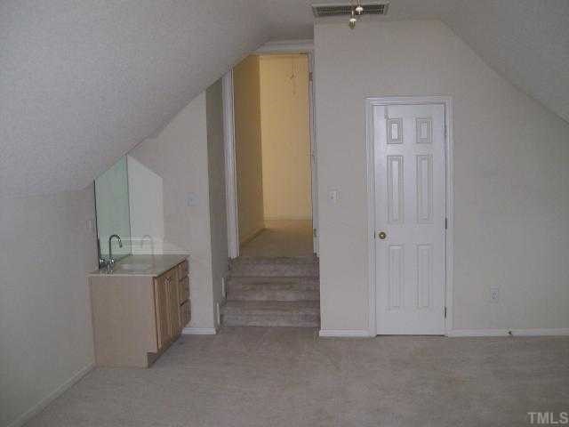 6301 Ashley Ridge Drive Raleigh, NC 27612 - Photo 8 of 12 a view of a room with staircase