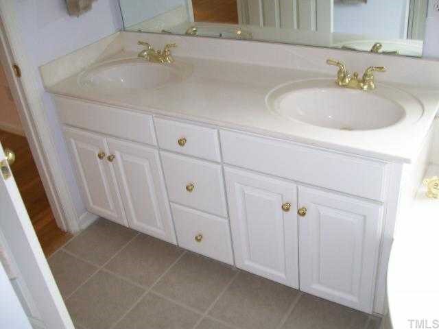 6301 Ashley Ridge Drive Raleigh, NC 27612 - Photo 10 of 12 a bathroom with a sink and vanity