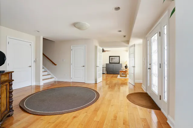 a view of a livingroom with furniture and entryway