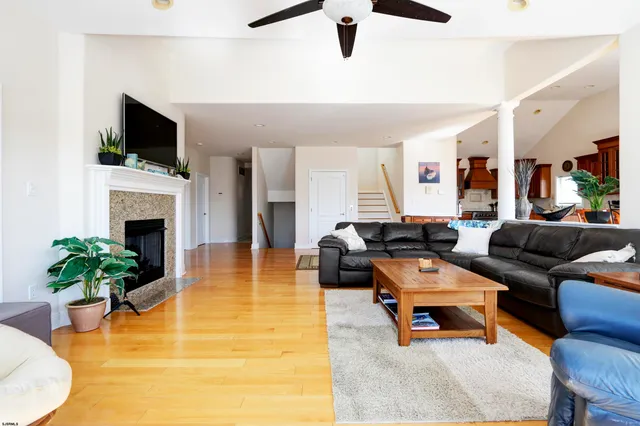 a living room with furniture and a fireplace