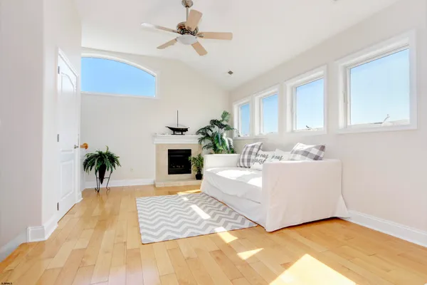 a bedroom with a bed and a couch with window