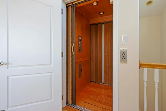 a view of a bathroom from a hallway