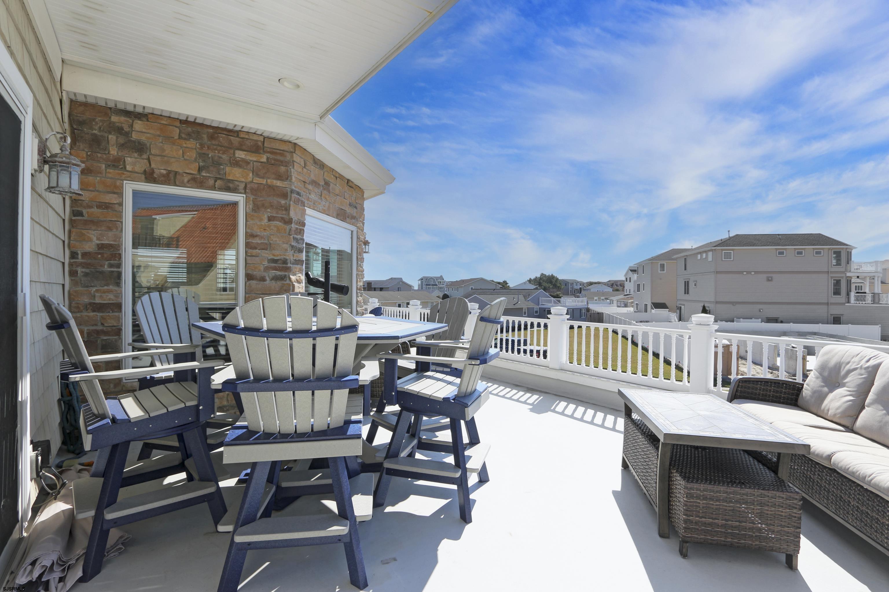 5219 Seaspray Road Brigantine, NJ 08203 - Photo 5 of 39 a view of a balcony with furniture