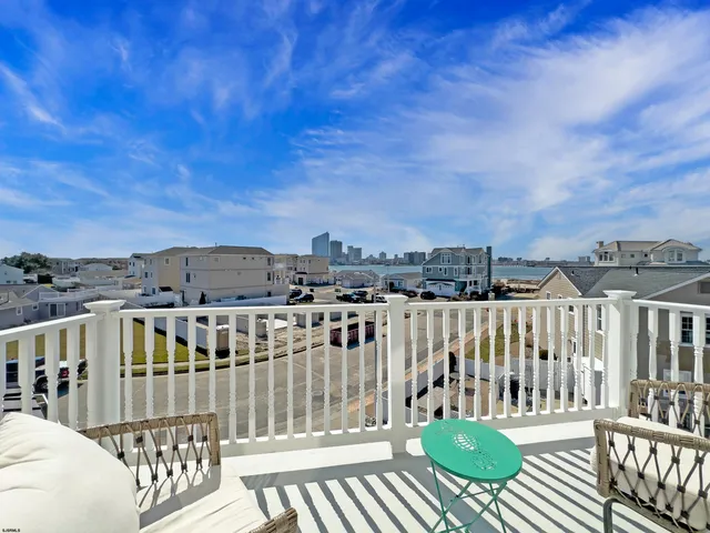 a view of a balcony with chairs