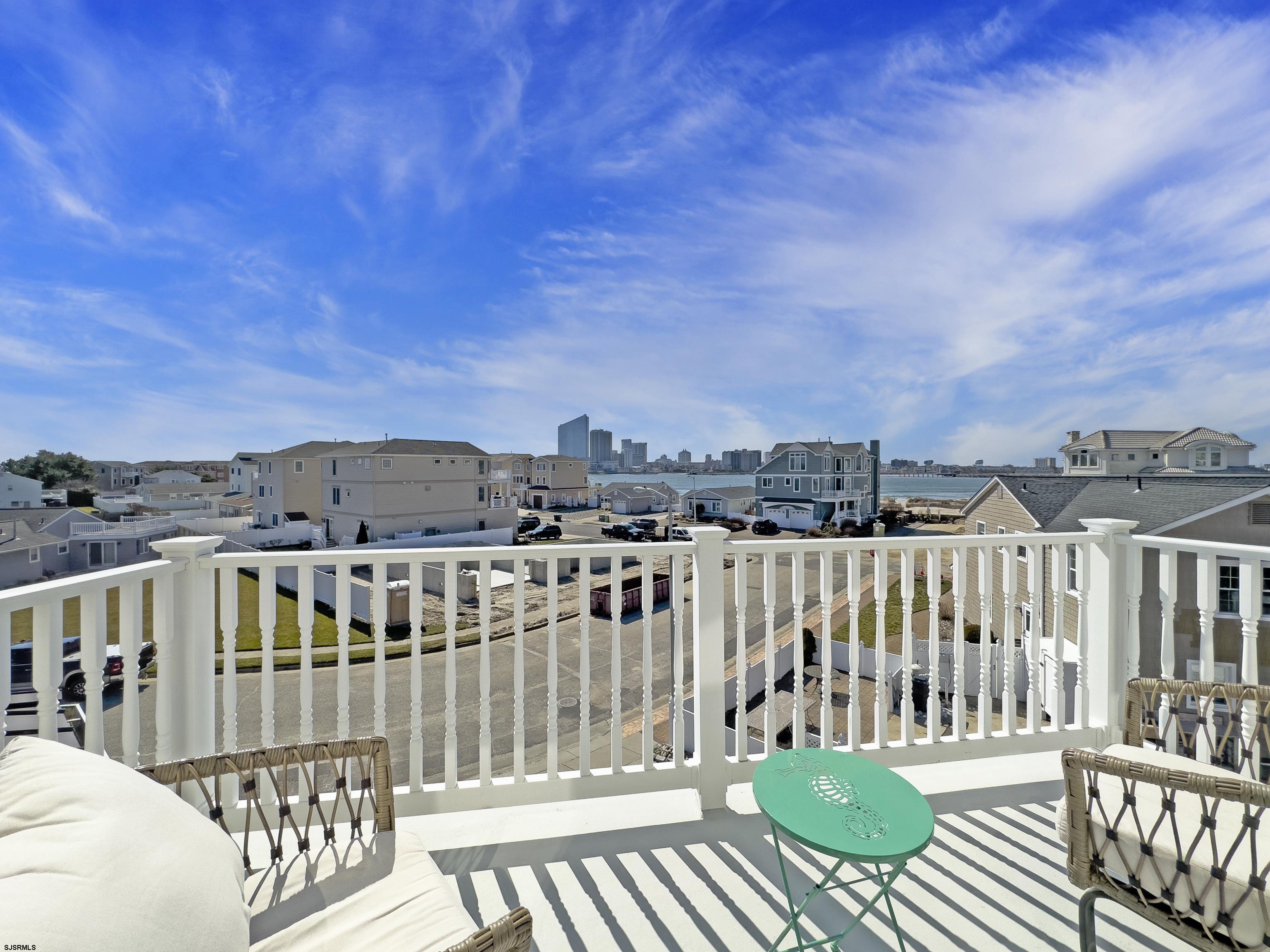 5219 Seaspray Road Brigantine, NJ 08203 - Photo 7 of 39 a view of a balcony with chairs