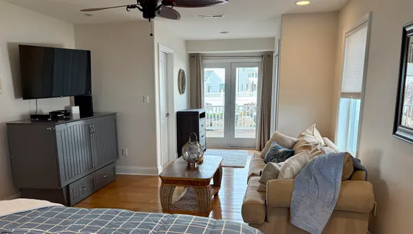 a bed room with a bed and a chandelier