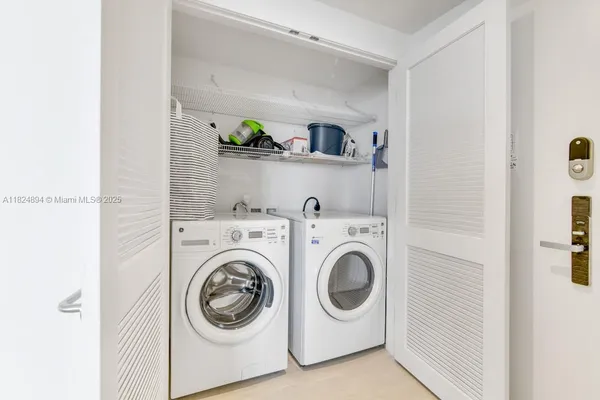 a view of a balcony with table and chairs