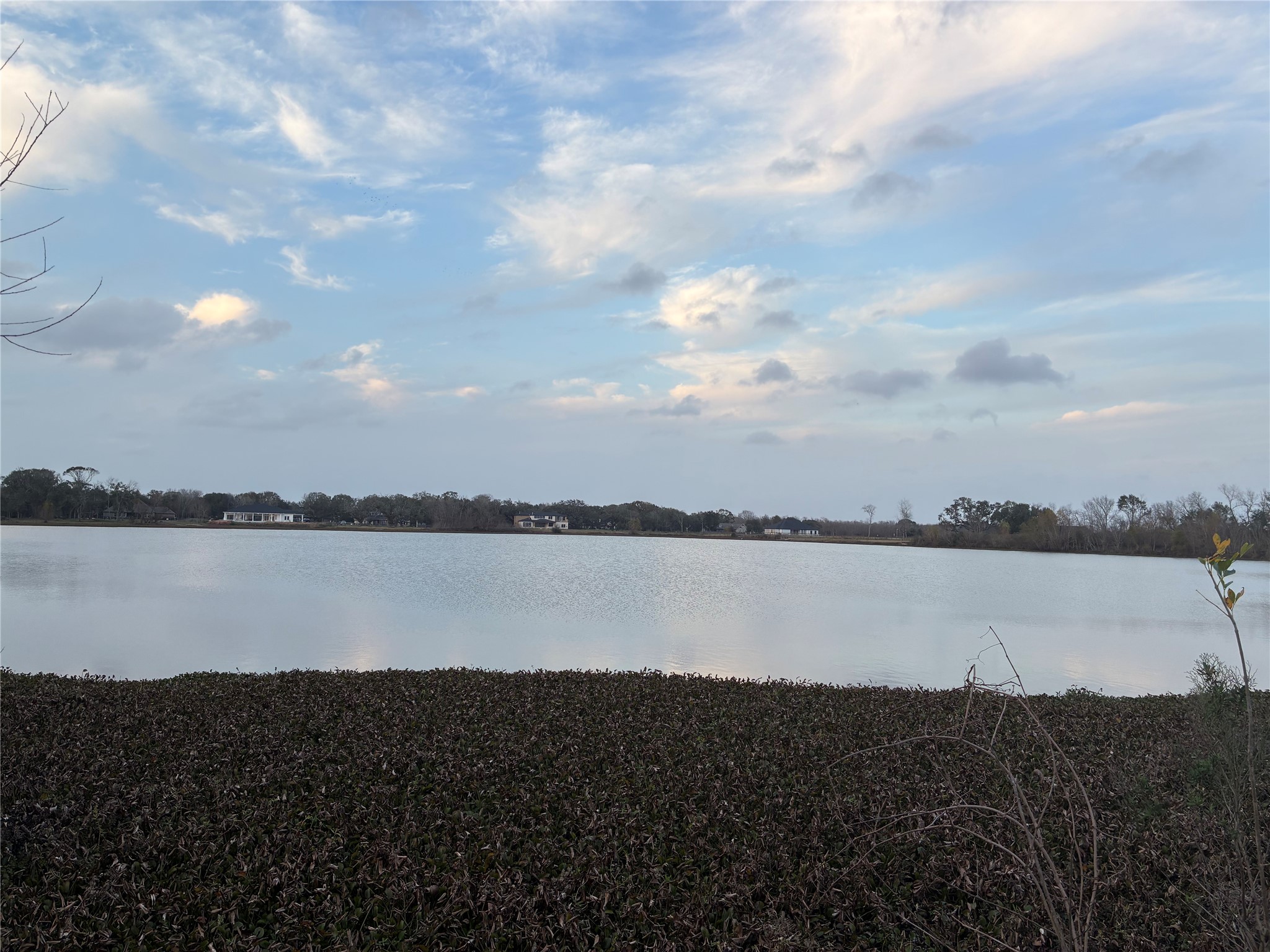 21210 Chenango Lake Drive Angleton, TX 77515 - Photo 3 of 15 a view of a lake and a lake