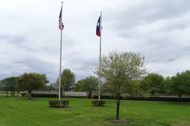a view of a sign board with a bench