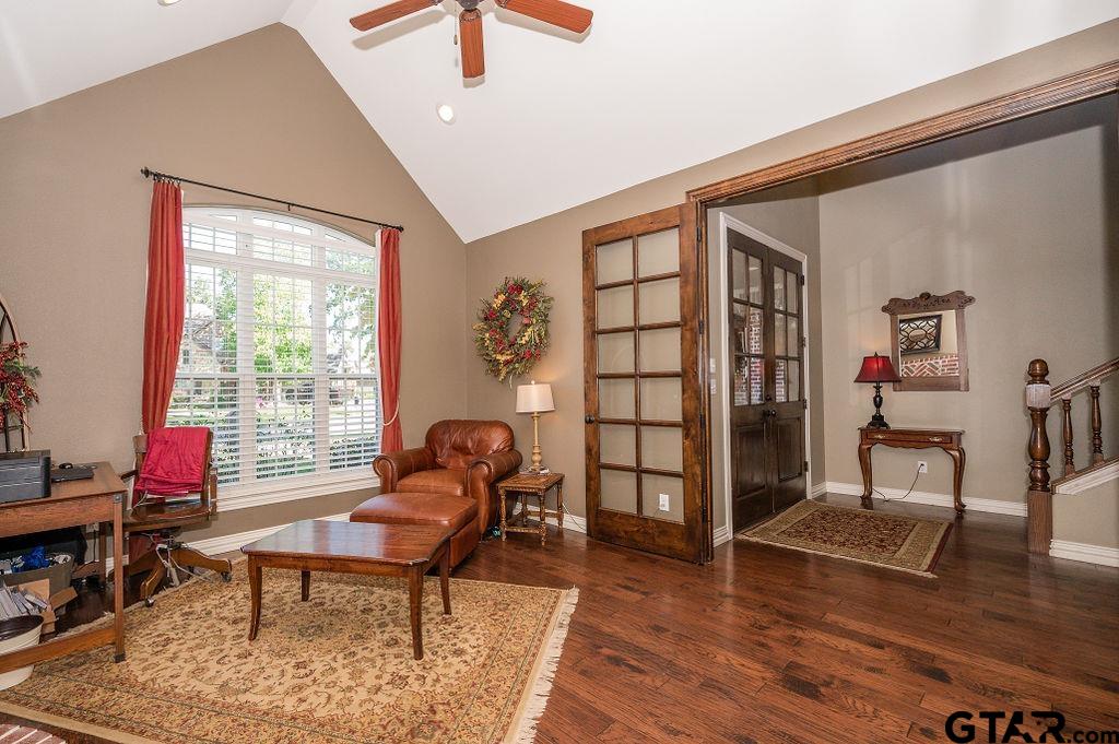 8553 Castleton Way Tyler, TX 75703 - Photo 17 of 38 a living room with furniture a rug and a large window