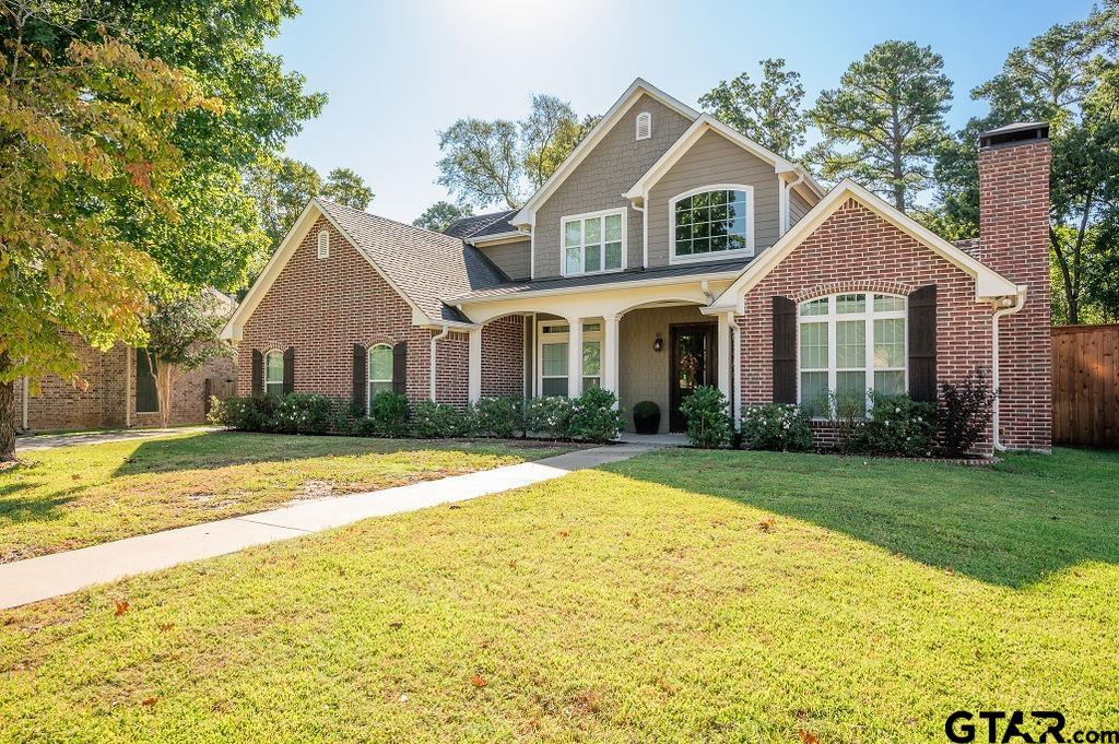 8553 Castleton Way Tyler, TX 75703 - Photo 2 of 38 a front view of a house with a yard