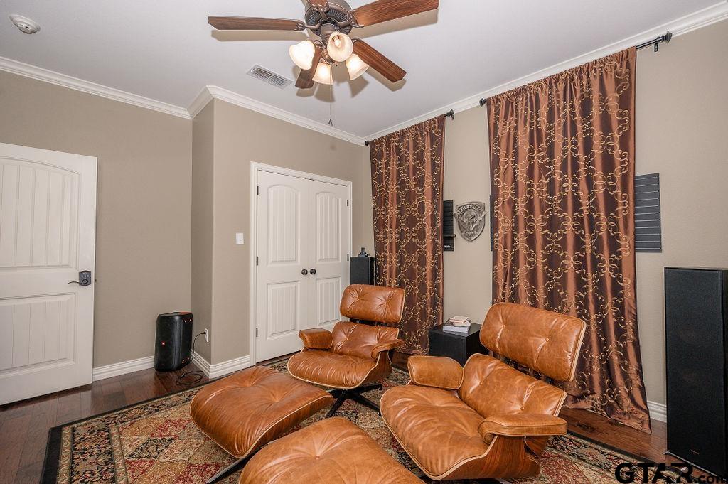 8553 Castleton Way Tyler, TX 75703 - Photo 25 of 38 a bedroom with furniture and wooden floor