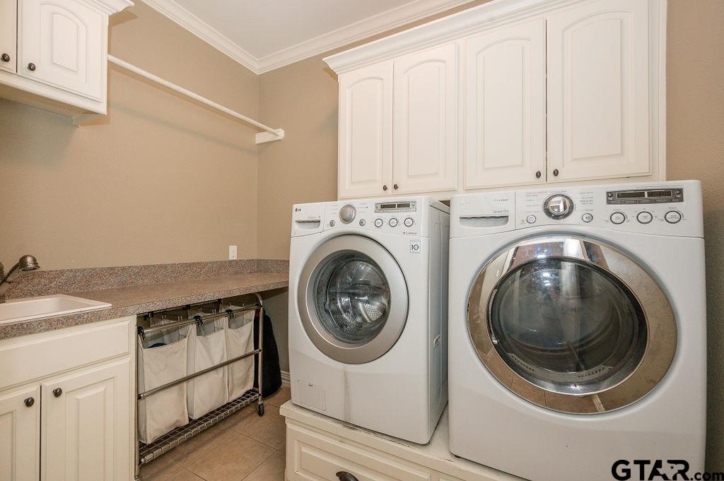 8553 Castleton Way Tyler, TX 75703 - Photo 27 of 38 a utility room with dryer and washer
