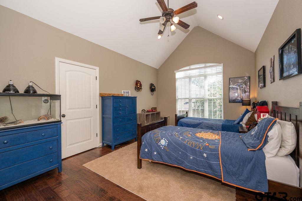 8553 Castleton Way Tyler, TX 75703 - Photo 31 of 38 a bedroom with a bed and a dresser