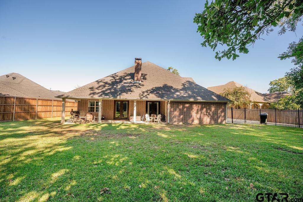 8553 Castleton Way Tyler, TX 75703 - Photo 36 of 38 a front view of a house with a yard