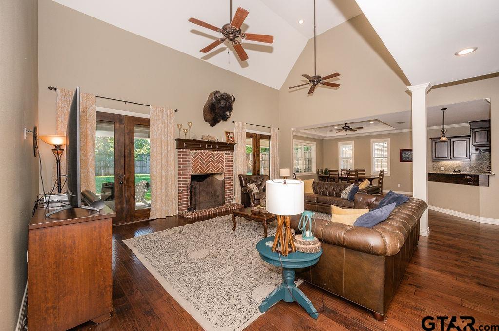 8553 Castleton Way Tyler, TX 75703 - Photo 8 of 38 a living room with furniture kitchen view and a chandelier