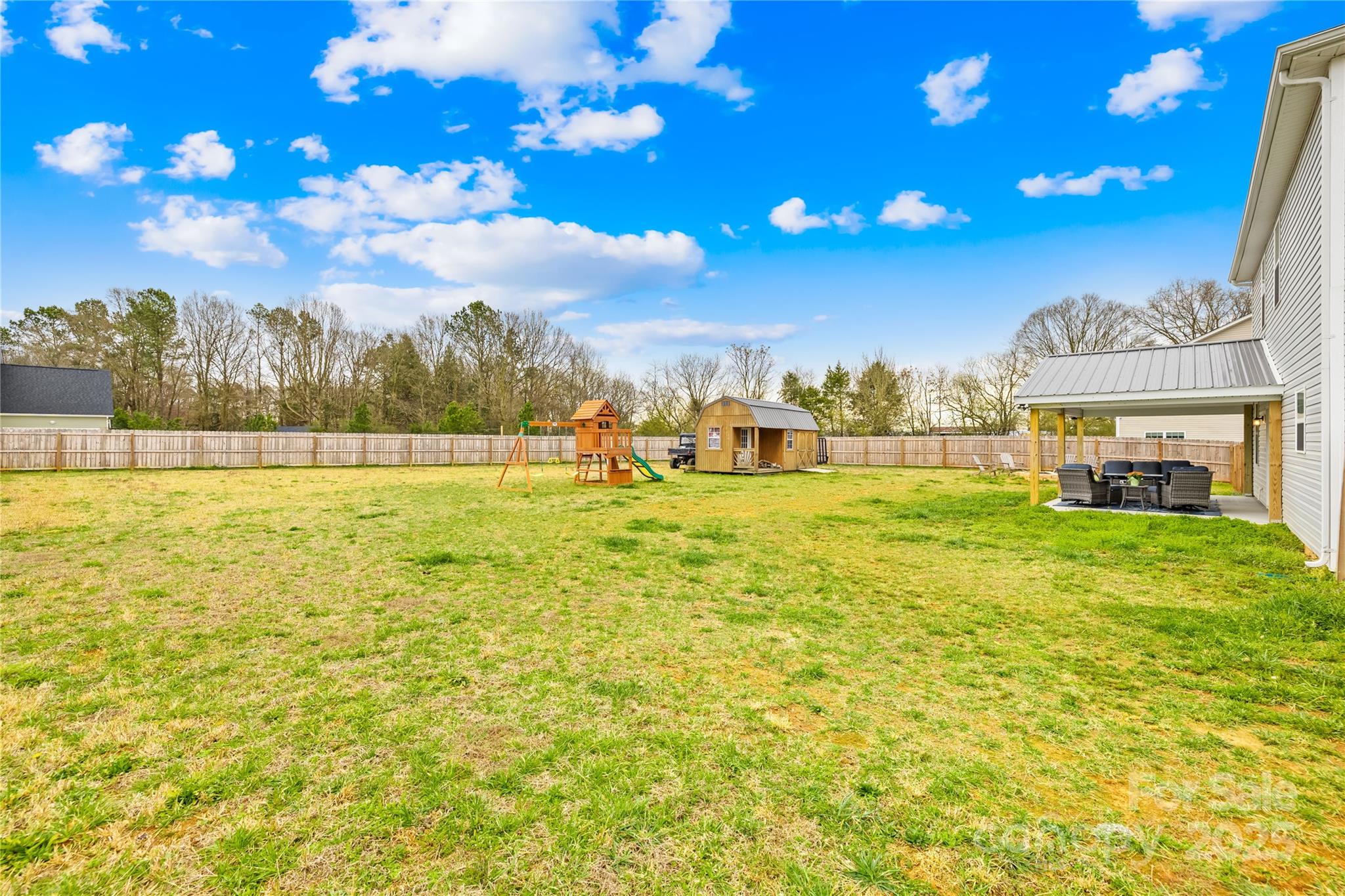 5405 Austin Road Monroe, NC 28112 - Photo 32 of 38 a view of an swimming pool with an outdoor space and seating area