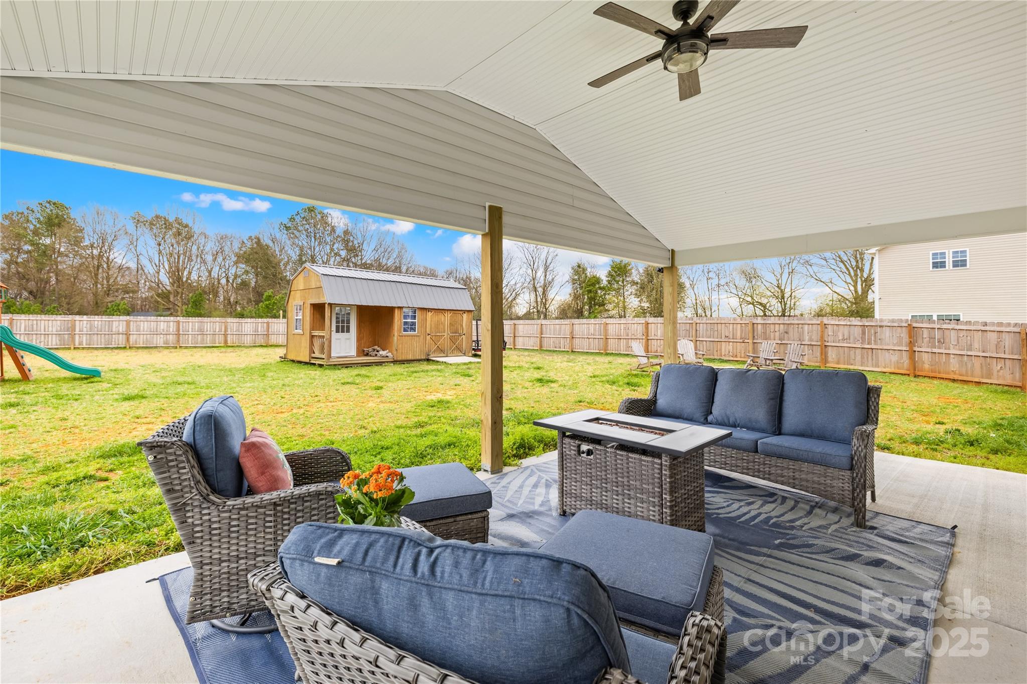 5405 Austin Road Monroe, NC 28112 - Photo 5 of 38 a outdoor living space with furniture and garden view