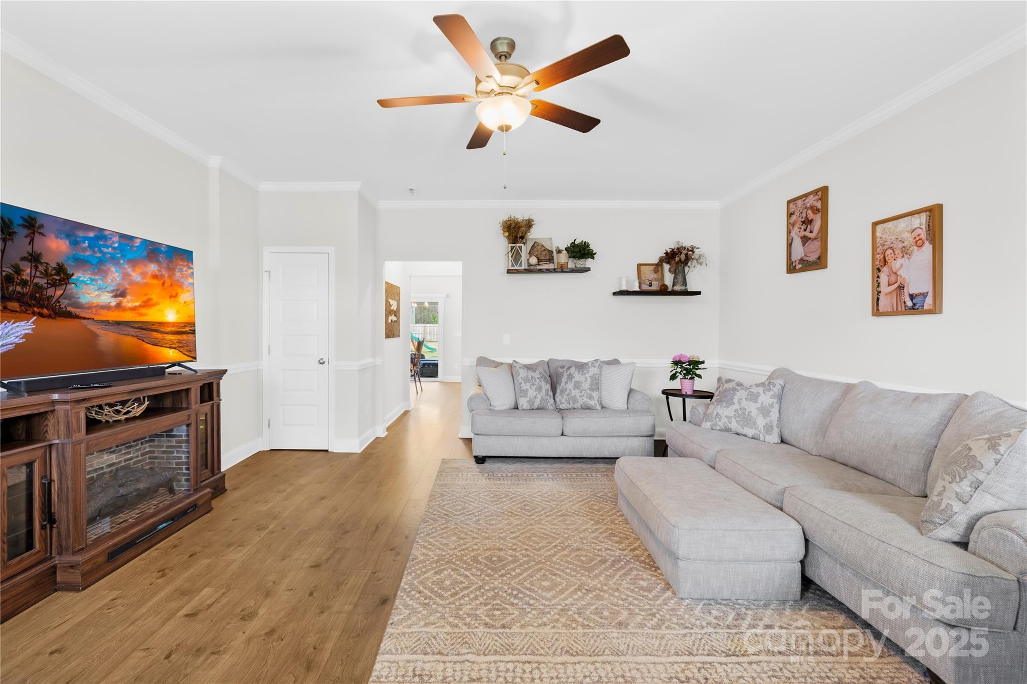 5405 Austin Road Monroe, NC 28112 - Photo 7 of 38 a living room with furniture and a flat screen tv