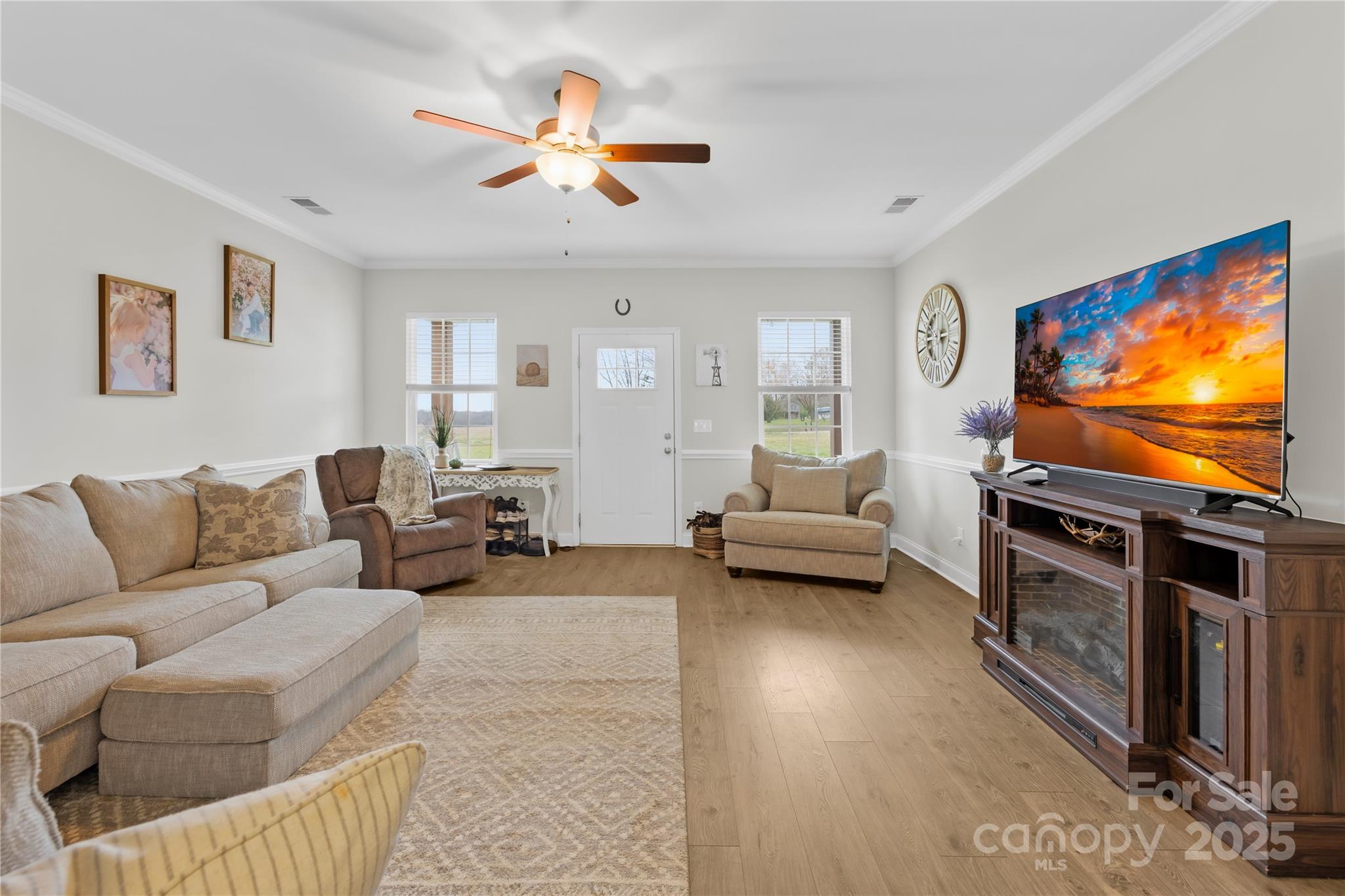 5405 Austin Road Monroe, NC 28112 - Photo 9 of 38 a living room with furniture and a flat screen tv