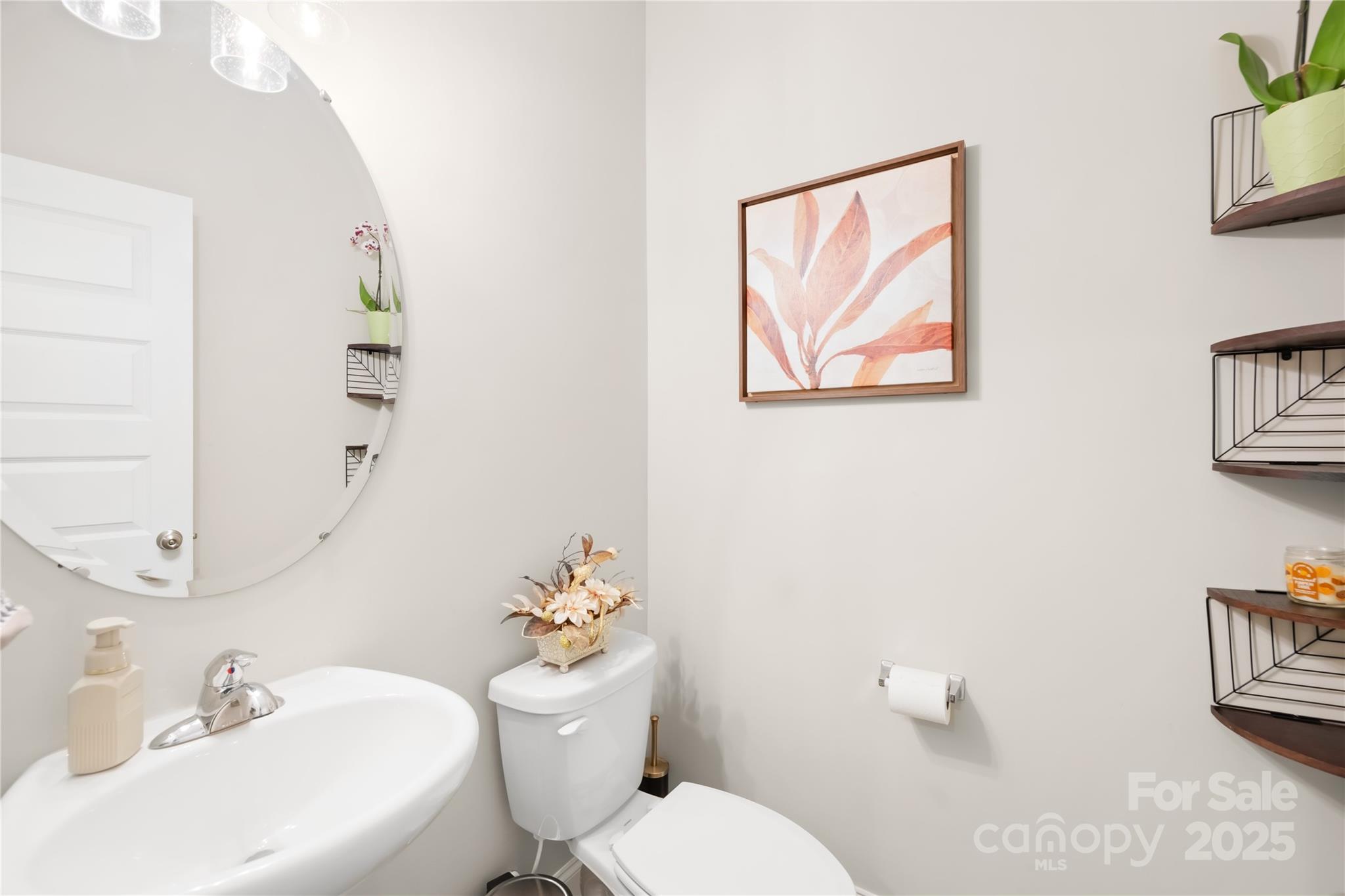 5405 Austin Road Monroe, NC 28112 - Photo 10 of 38 a white toilet sitting next to a bathroom sink