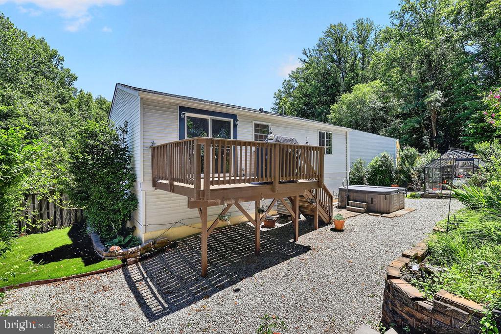 8471 Great Lake Lane Springfield, VA 22153 - Photo 39 of 65 a view of a house with backyard and sitting area