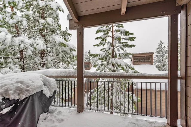 a view of a balcony with wooden floor