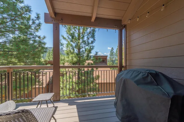 a balcony with wooden floor