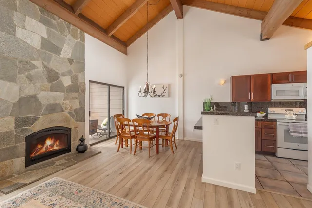 a dining room with furniture and wooden floor
