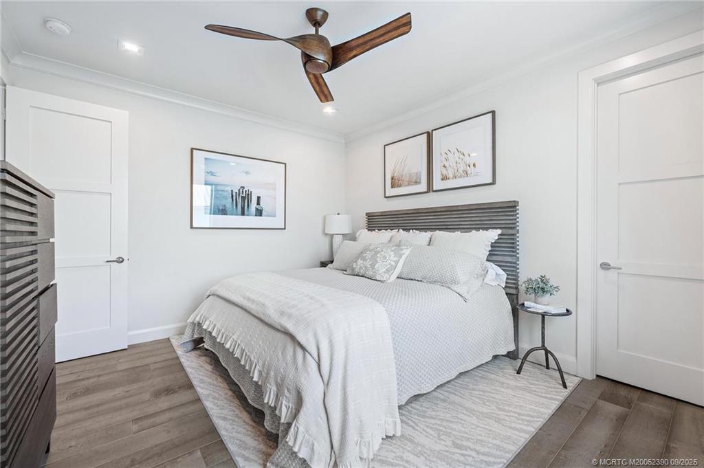 4860 Watersong Way Fort Pierce, FL 34949 - Photo 24 of 45 a bedroom with a bed and a painting on the wall