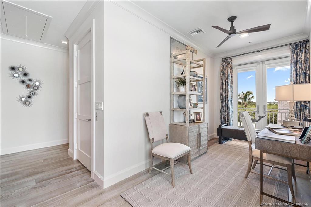 4860 Watersong Way Fort Pierce, FL 34949 - Photo 26 of 45 a living room with furniture a table and a potted plant