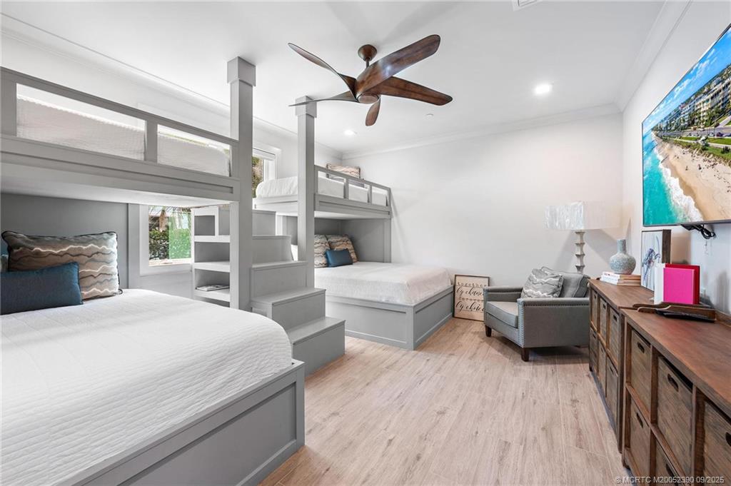 4860 Watersong Way Fort Pierce, FL 34949 - Photo 27 of 45 a bedroom with a bed and a large window