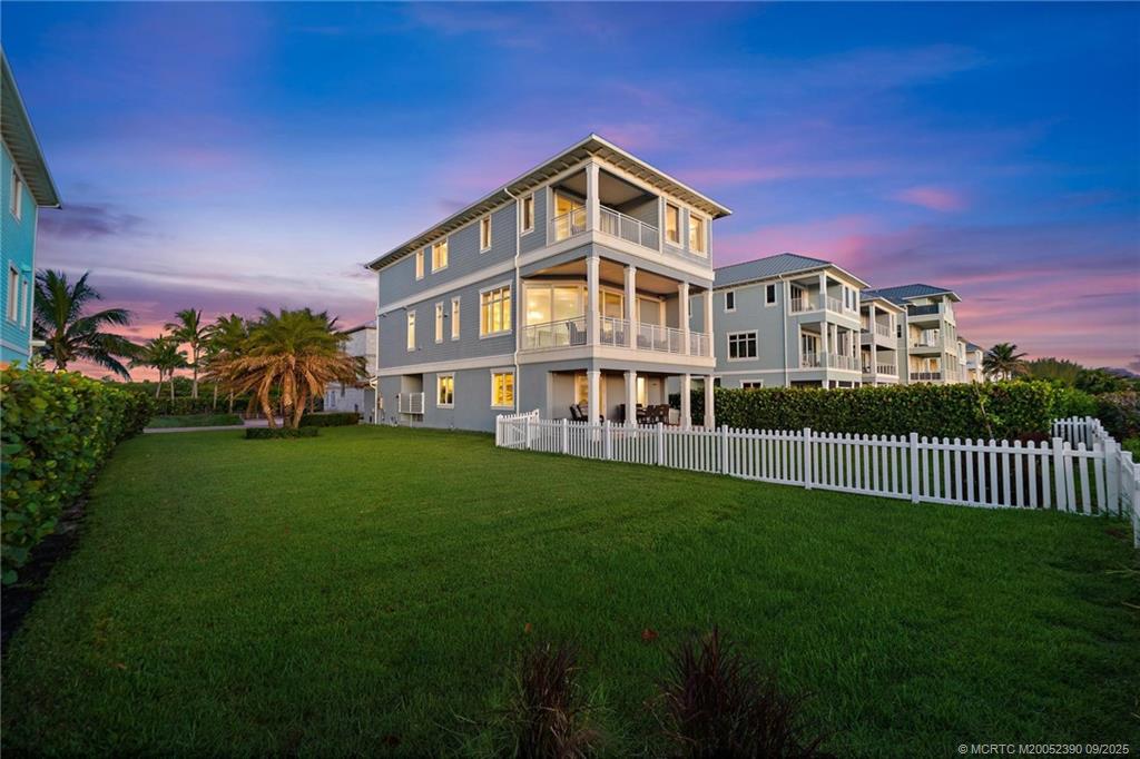 4860 Watersong Way Fort Pierce, FL 34949 - Photo 3 of 45 a front view of a house with a yard