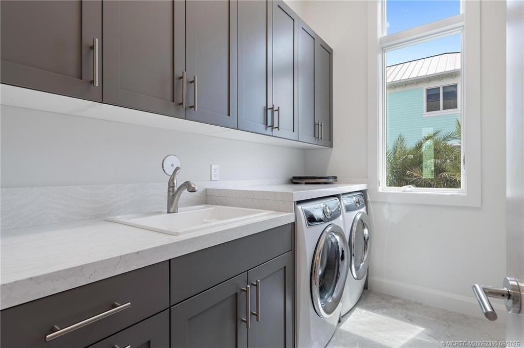 4860 Watersong Way Fort Pierce, FL 34949 - Photo 36 of 45 a utility room with sink dryer and washer