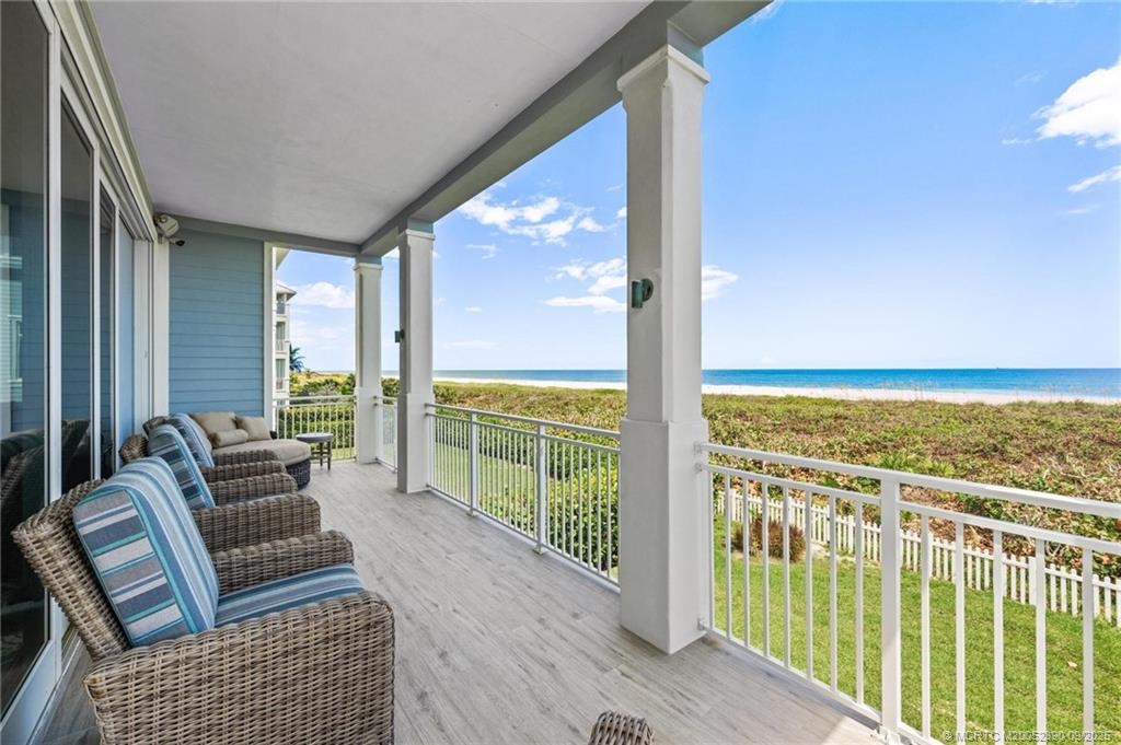 4860 Watersong Way Fort Pierce, FL 34949 - Photo 37 of 45 a balcony with furniture and city view