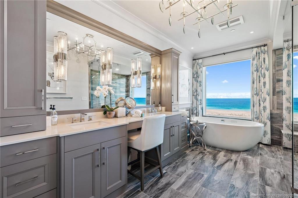4860 Watersong Way Fort Pierce, FL 34949 - Photo 7 of 45 a bathroom with a sink double vanity granite tub and shower
